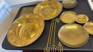 Collection of brass chargers, dishes and fire-toasting forks