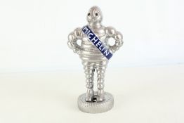 Small chrome Michelin man figure