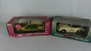 Two boxed 1:18 die-cast Polizei model vehicles