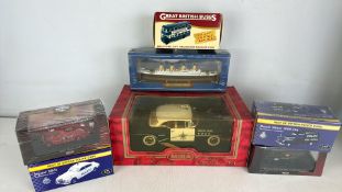 A group of boxed die-cast scale vehicle models including MIRA 1955 Buick Century and Great British