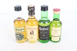 Group of miniature Scotch whisky bottles: Amdhu, Aberlour 10, Ardbeg 17, The Glenlivet 12