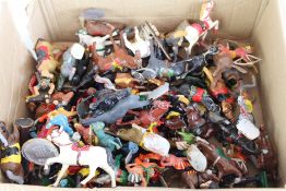 A quantity of mid-20th century toy cavalry figures and horses