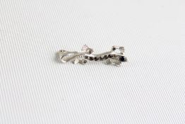 Silver lizard brooch with gemstones