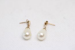 Pair of 9ct gold earring set with stimulated pearl