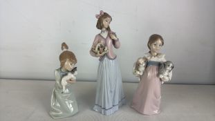 A group of three Lladro porcelain figures