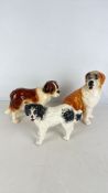 Three Staffordshire-style pottery dog figures