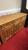 Pine sideboard with drawers and panelled cupboard doors