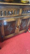 Arts and Crafts oak dresser with arched scalloped rack