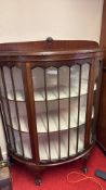 Edwardian-style mahogany bowed-glass display cabinet