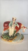 Staffordshire pearlware figure group of a herdsman and cow