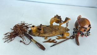 Group of ethnographic curios including carved camel group and beaded gourd vessel