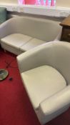 Contemporary cream upholstered two-seat sofa and tub armchair
