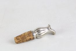 Silver top wine bottle top