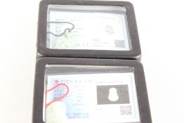 2 boxed jade pendants