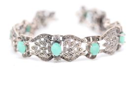 Silver & possibly emerald bracelet
