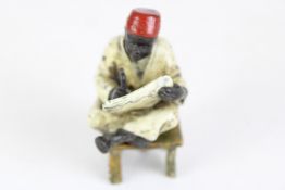 Cold painted Bergamn bronze seated african
