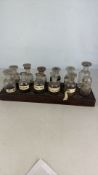 Group of Glass Stoppered Reagent Bottles in Wooden