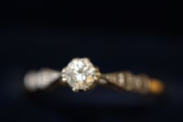 High carat gold possibly 18ct ring set with solita