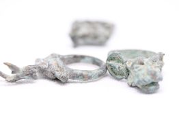 3x Mythical creature rings, possibly bronze