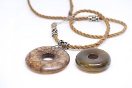 2x Possibly Jade pendants 1 on rope chain