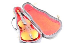 Novelty miniature guitar with case