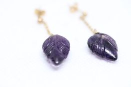Pair of 9ct gold earrings set with purple stone
