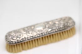 Silver clothes brush