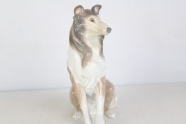 Lladro glazed porcelain figure of a seated collie, modelled with flowing mane and grey-and-cream