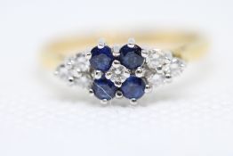 18ct yellow Gold ring set with 4 sapphires & 7 dia
