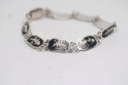 Silver bracelet with etched panels