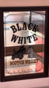 Two framed Scotch whisky advertising mirrors