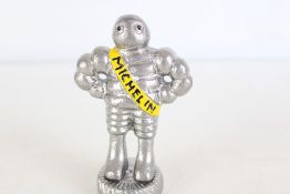 Small chrome Michelin man figure