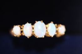 18ct Gold ring set with 5 opals Weight 1.9g Size L