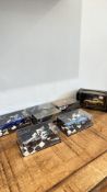 Five boxed die-cast model cars, including Minichamps Formula One and Corgi James Bond Aston Martin