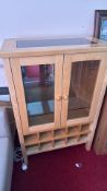 Bentley Designs hardwood glazed display cabinet with wine rack base and granite panel