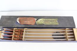 Archery arrows in labelled case