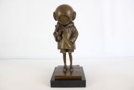 Bronze girl in a diving helemt inspired by banksy