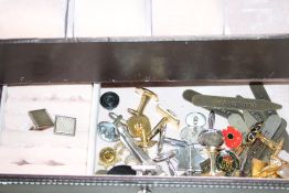 Collection of cufflinks & pin badges in a modern w