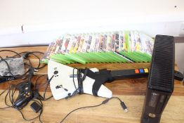 Microsoft Xbox 360 console with Kinect, controllers, guitar controller and assorted games