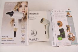 Boxed personal care appliances: Carmen hair dryer, MT-510 callus remover, Sanitas SEM 24 TENS