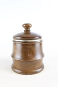 Turned hardwood tobacco jar with ceramic liner