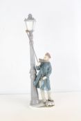 Lladro porcelain figure of a lamplighter beside a street lamp, Daisa 1983
