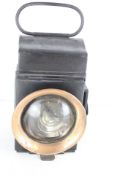 Hand-held lantern with convex glass lens