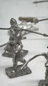 Group of cast white-metal toy soldier figures, spearmen and mounted figure