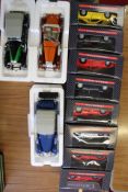 Collection of die-cast model cars, including boxed Ferrari models