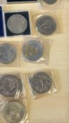 A quantity of British decimal coinage, crowns and commemorative medallions, in presentation holders