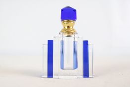 Art Deco-style cut crystal scent bottle with cobalt panels and faceted stopper