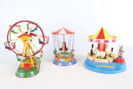 Group of tinplate fairground toys, including GAMA Magic Roundabout