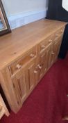 Pine sideboard with drawers and three cupboard doors