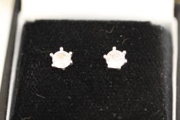 Boxed pair of silver earrings set with cz